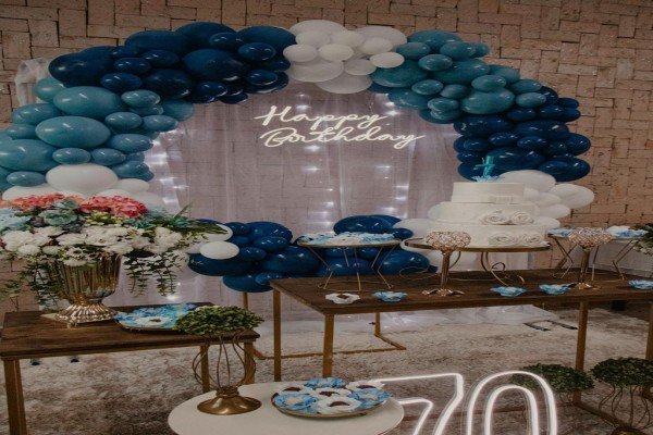 Birthday celebration cake with balloons candles and festive decoration