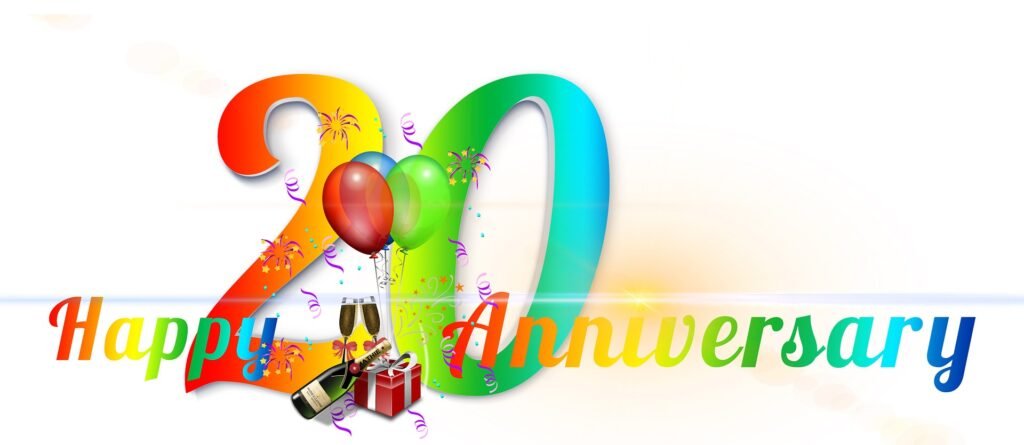 Happy 20th anniversary celebration with balloons gifts and champagne